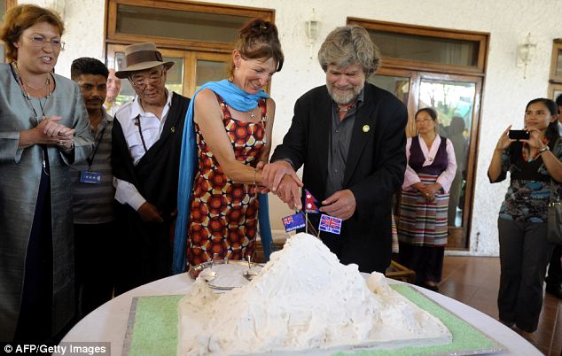 Climbing Everest? Piece of cake... Italian Reinhold Messner and New Zealander Lydia Bradey, the first male and female climbers to summit Mount Everest without oxygen, cut a cake at a ceremony to mark the anniversary