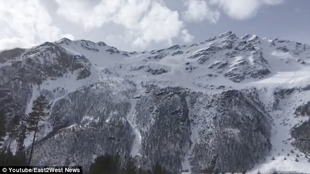 Footage shows the mountain calm at first, but then disaster strikes as the avalanche falls down the mountain